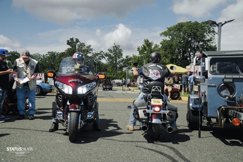 two biker group members showing off their motorcycles