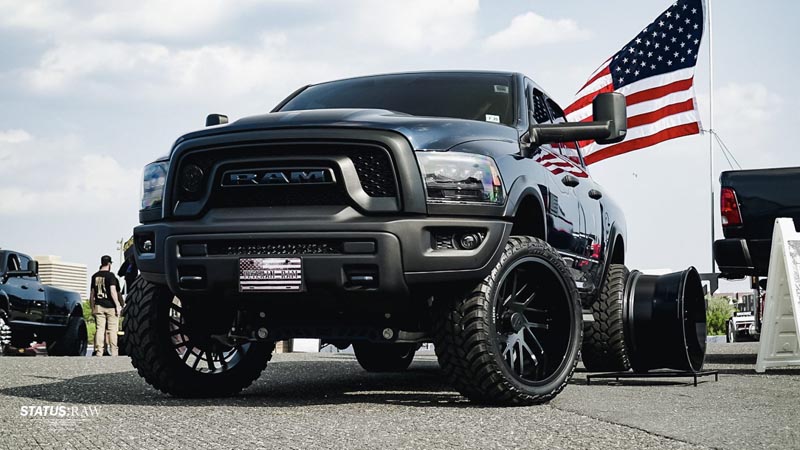 Veteran RAM truck posed for an event, showcasing custom rims