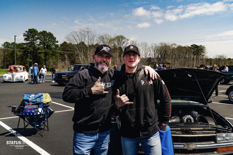 Andre and supporter posing for a photo at an event