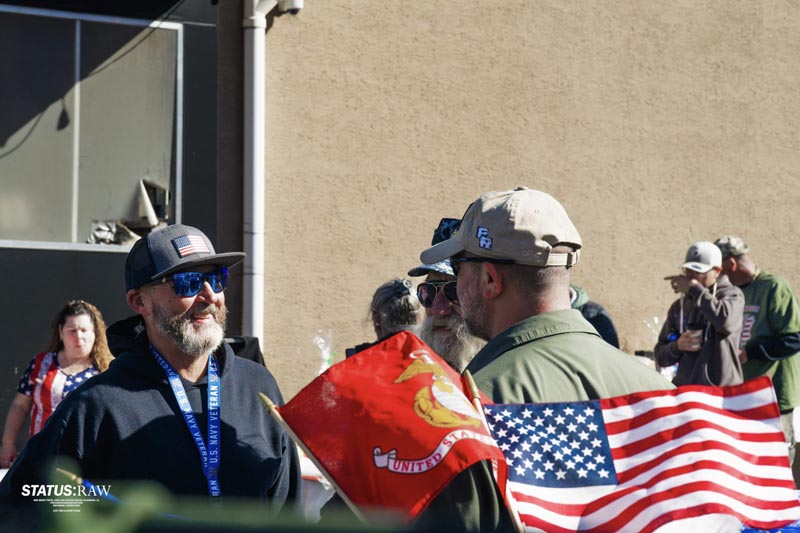 Andre speaking to an attendee at an event