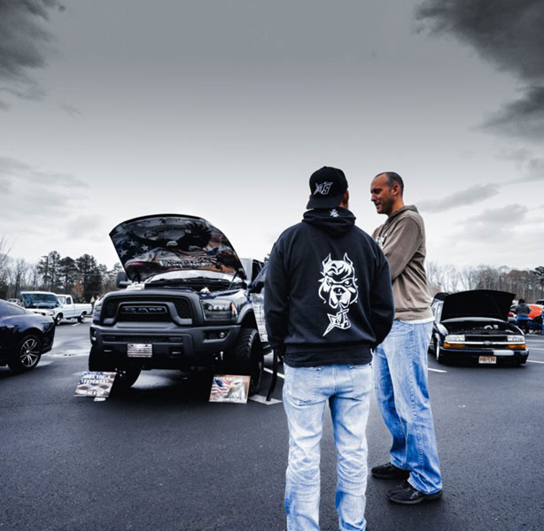 Andre speaking to an attendee at an event