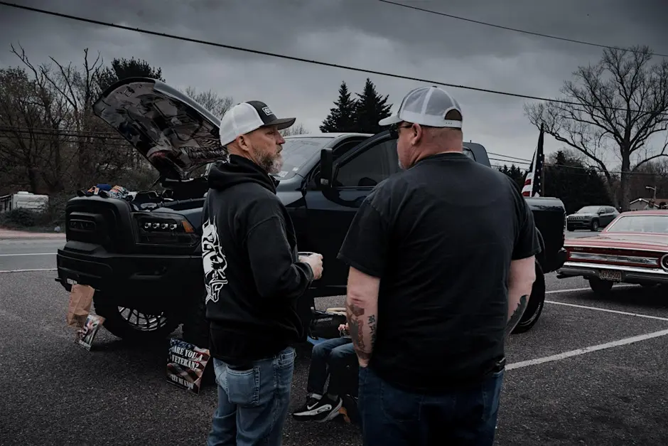 Andre speaking to an attendee at an event