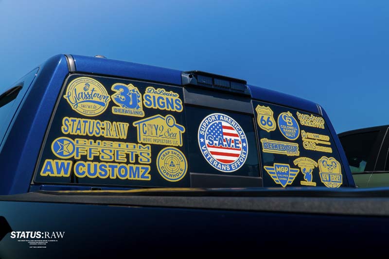 Pick-Up Truck with lots of sticker on the back wind-shield