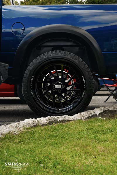 Side view of truck with black custom wheel and tire