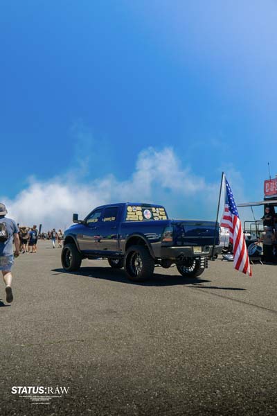 RAM pick-up truck with American flag attached.