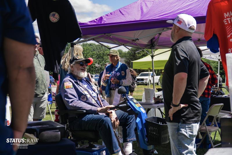 People gathered at outdoor veterans event